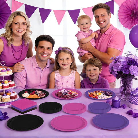 Pink and purple themed party table with the tableware
