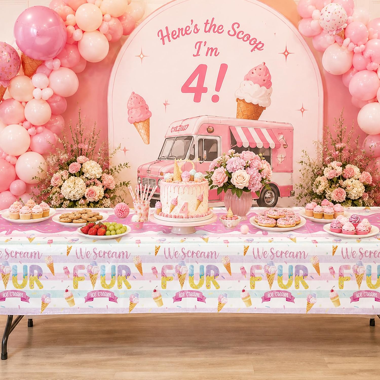 Girls 4th birthday party scene with ice cream themed tablecloth