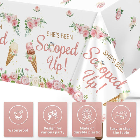 Close-up of bridal shower plastic tablecloth with She's Been Scooped Up lettering