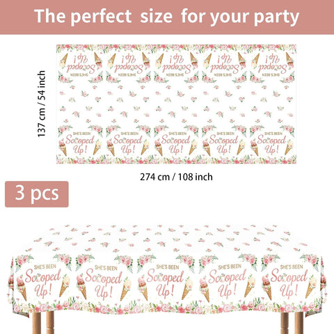 Flat lay of three ice cream bridal shower tablecloths with floral pattern