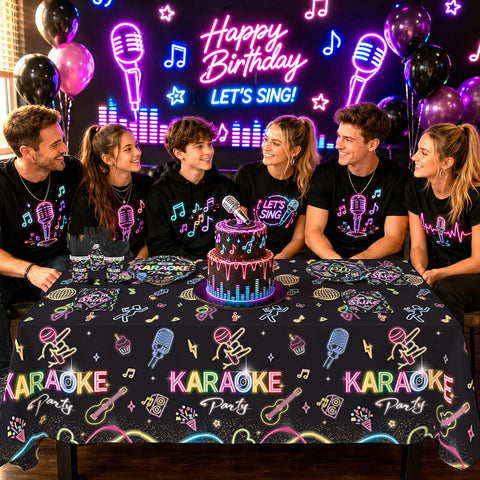 Karaoke birthday party scene with friends gathered around a neon-themed table featuring a birthday cake with microphone topper