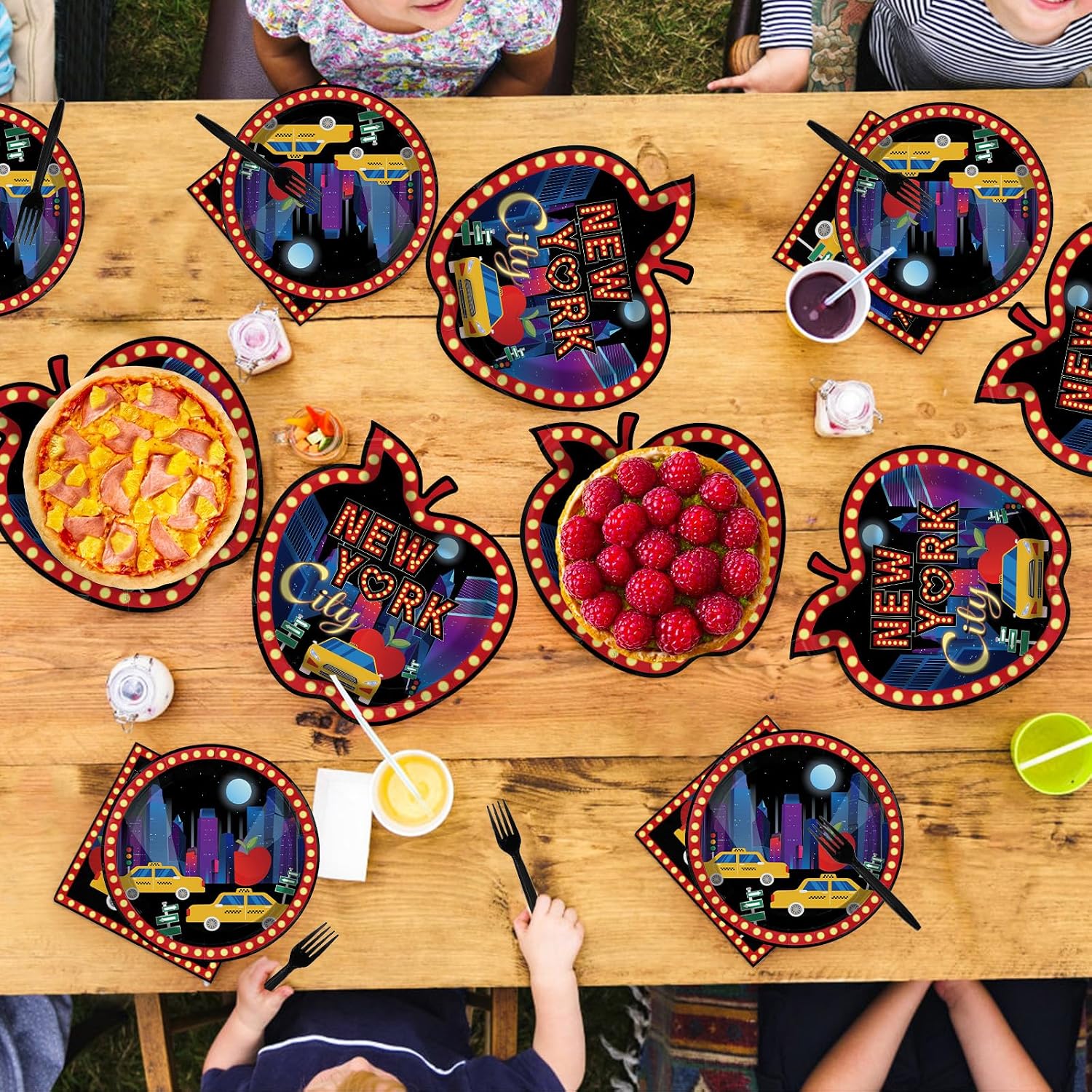 New York themed party table with the apple shaped plates