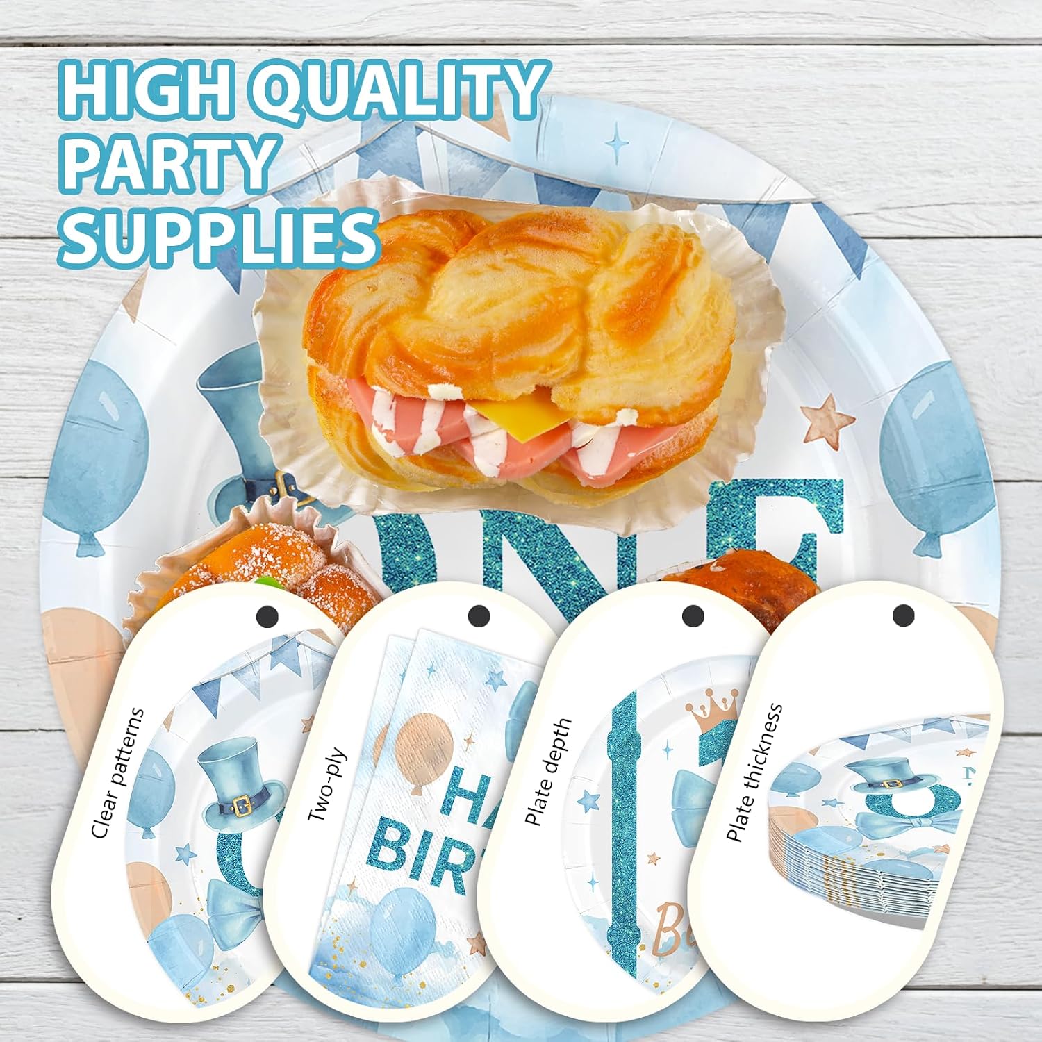 Stack of blue and white 1st birthday themed plates and napkins
