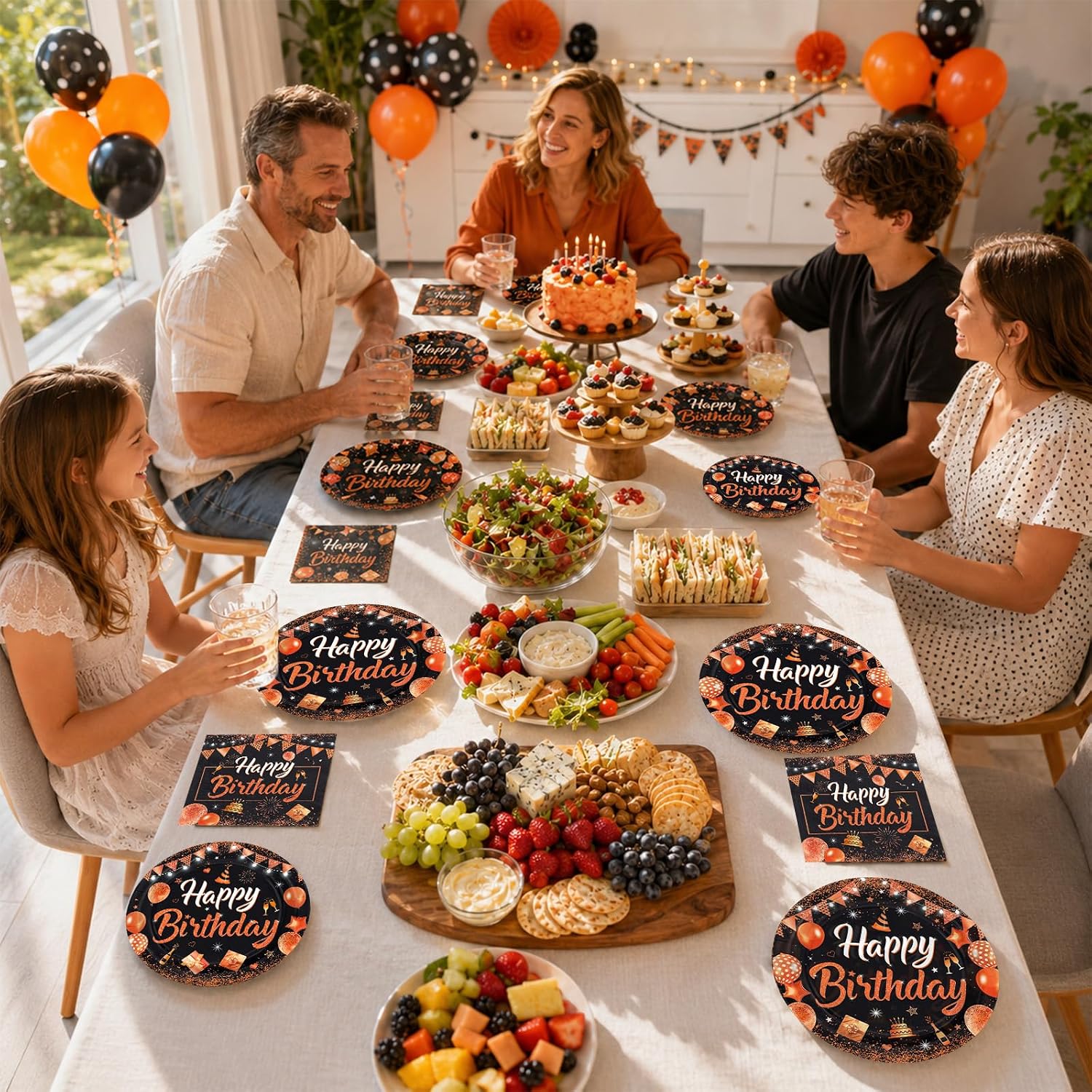 Close up of the orange confetti and gift box print on a black birthday plate