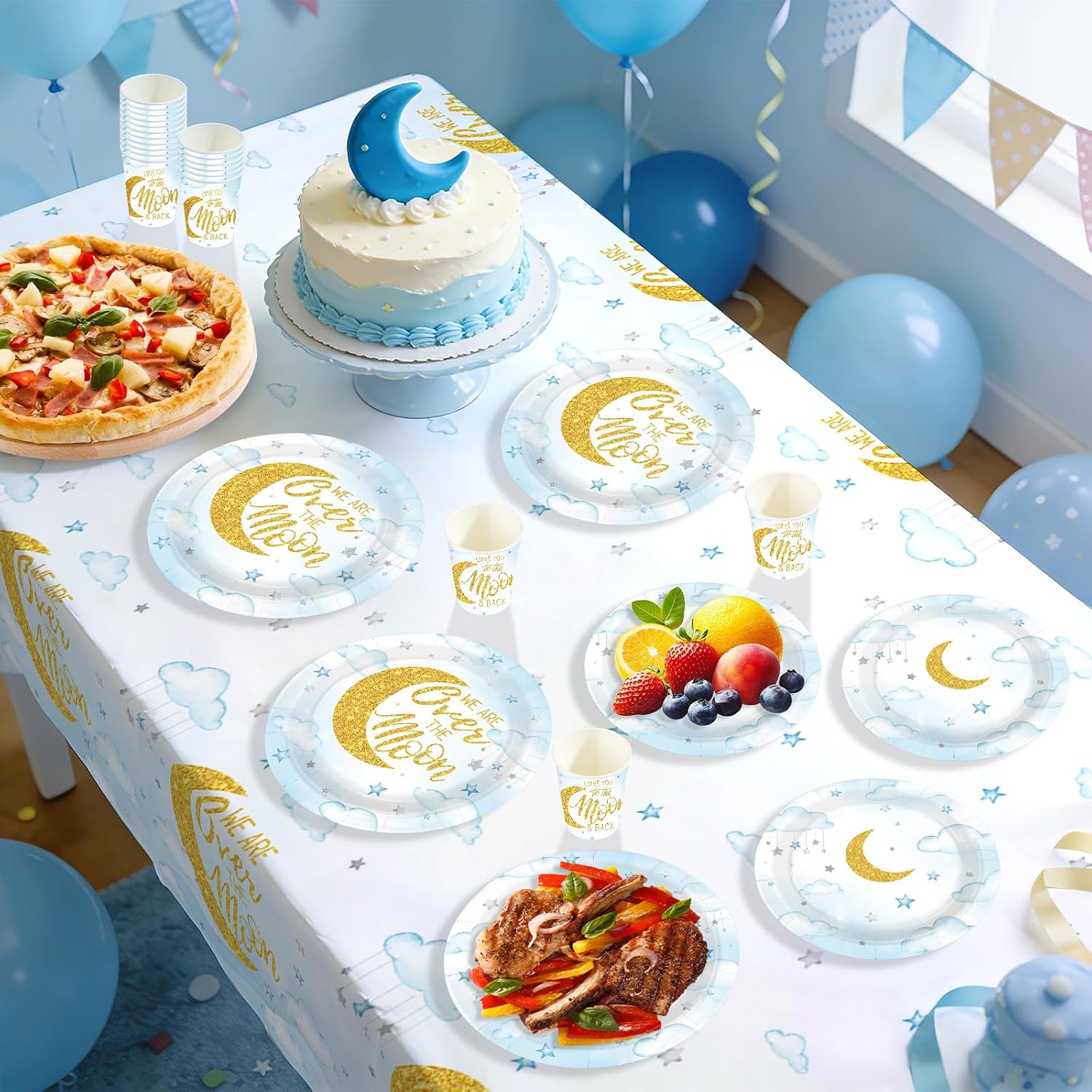 Over The Moon baby shower table with pastel blue tableware