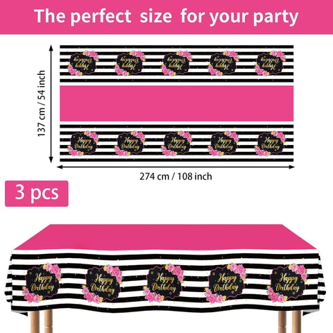 Pink black tablecloth draped on party table with rose themed decorations