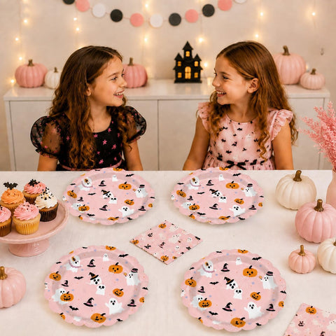 Guests at a pink Halloween party with the ghost plates
