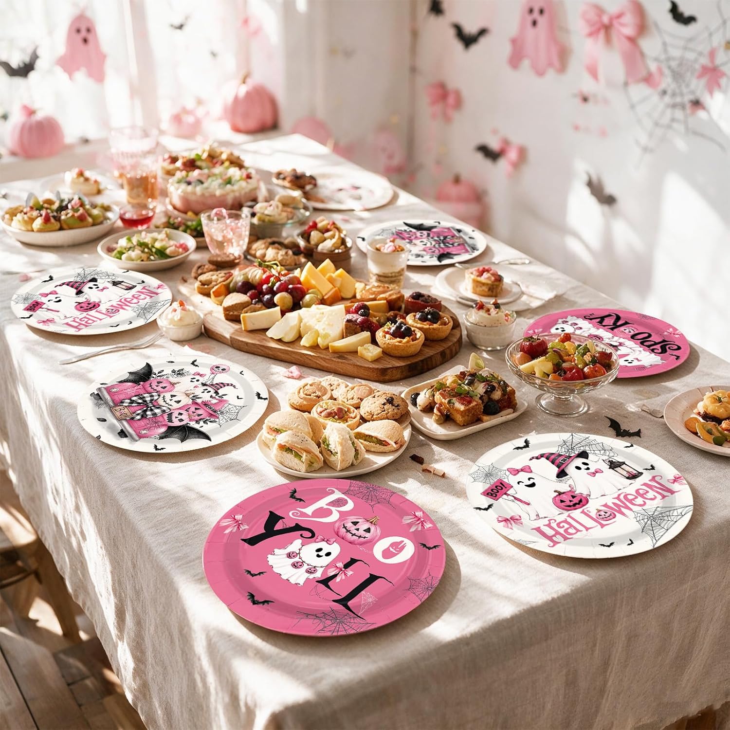 Girls Halloween party table set with the pink paper plates