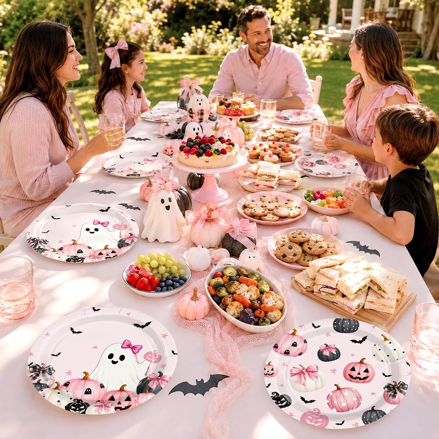 Outdoor Halloween party table with the pink paper plates