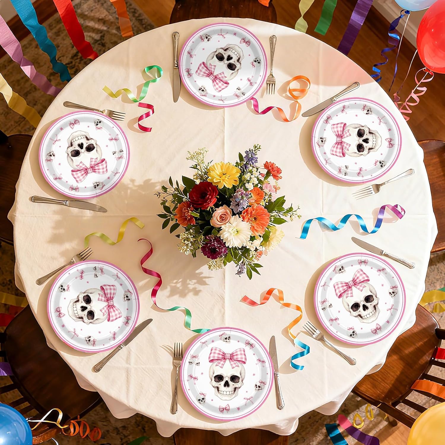 Coquette goth table styled with the pink skull plates