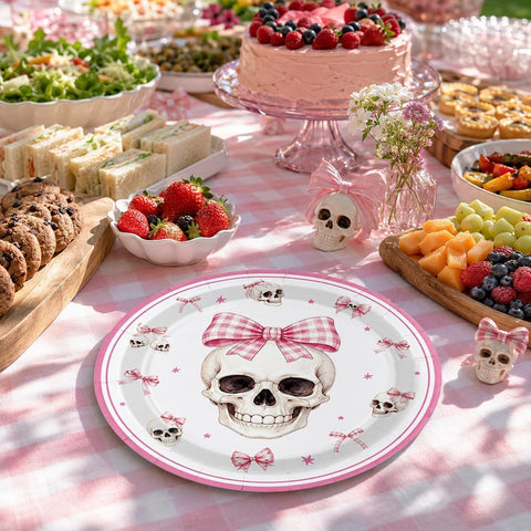 Pink Halloween party table with the skull and bow plates