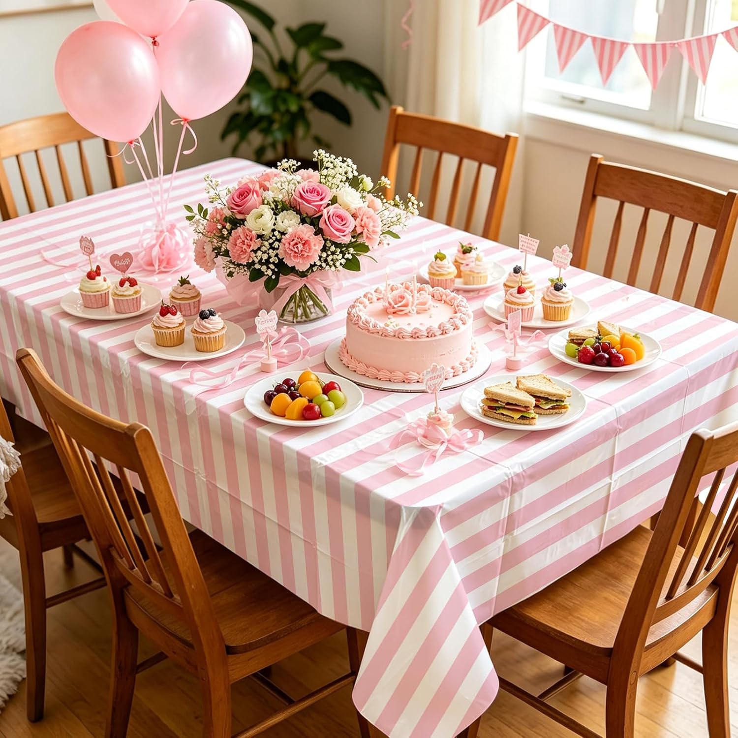 Girls women wedding birthday party scene with pink striped tablecloth