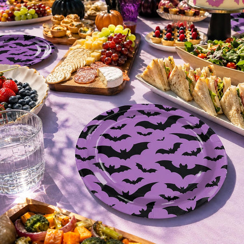 Halloween buffet table styled with the purple bat plates