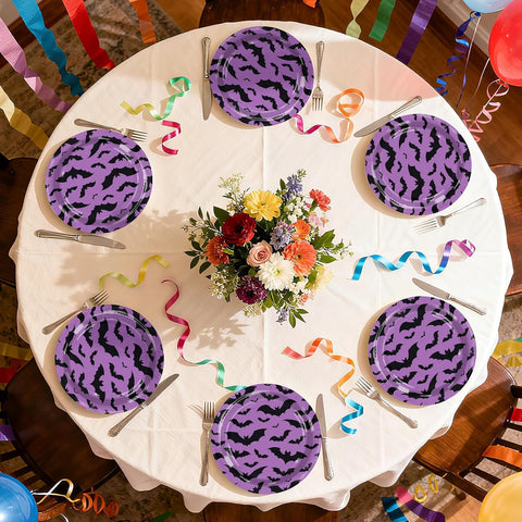 Round party table set with the purple bat paper plates