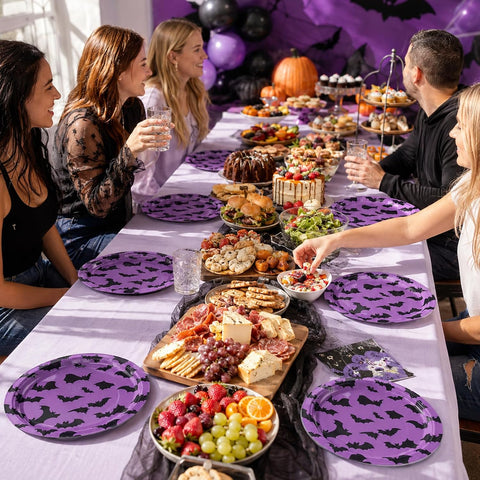 Long Halloween table with the purple bat plates and balloons