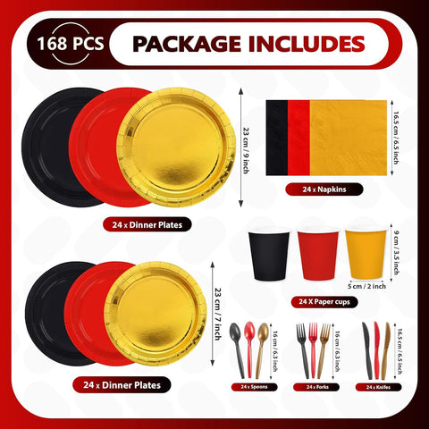 Red black and gold plates cups and cutlery flat lay