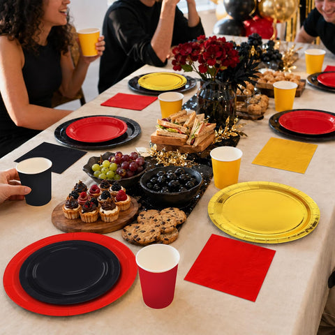 Party table styled with the red black gold tableware