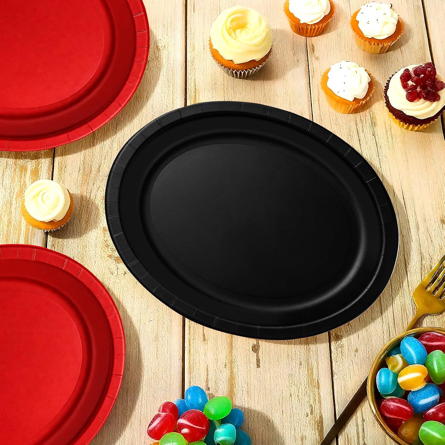 Red and black oval platters holding party food