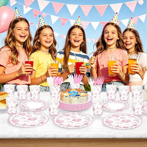 Girl summer birthday party table with pink seashell tableware