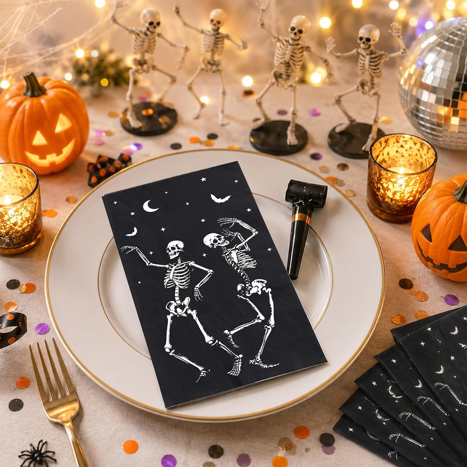 Halloween skeleton napkins styled on a spooky dinner table