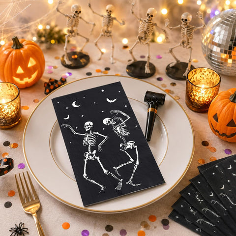 Halloween skeleton napkins styled on a spooky dinner table