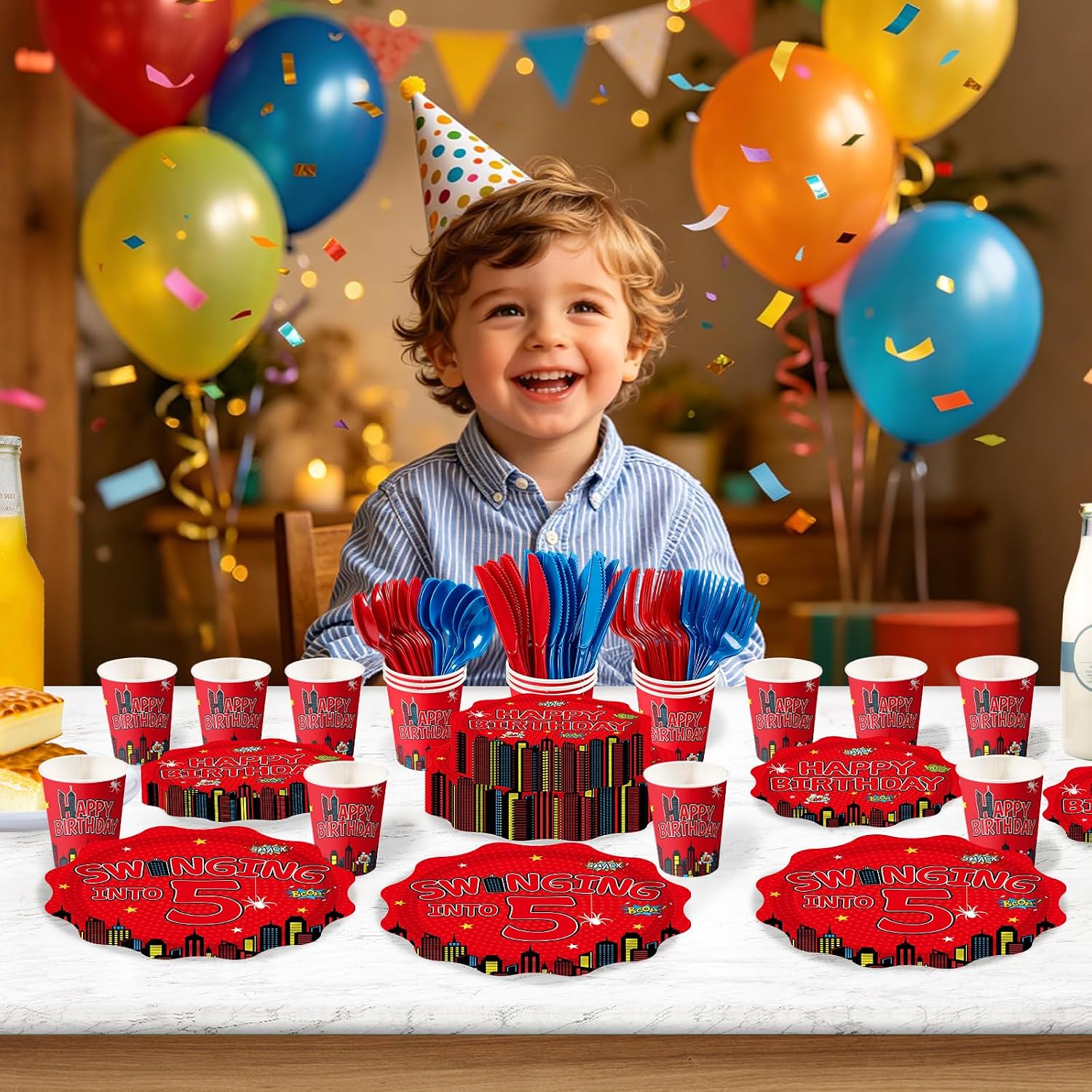 Spider 5th birthday party table with red blue tableware
