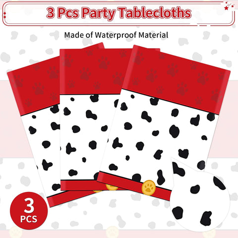 Spotted dog tablecloth draped on party table with puppy themed decorations