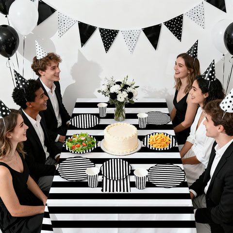 Wedding party scene with black white stripes tableware