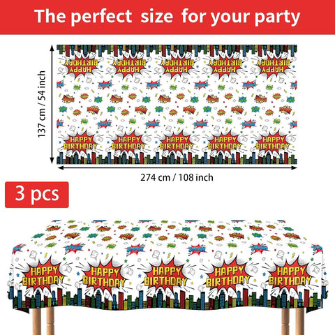 Flat lay of three super hero tablecloths with action sign pattern