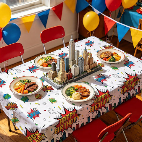 Boys hero birthday party scene with superhero themed tablecloth