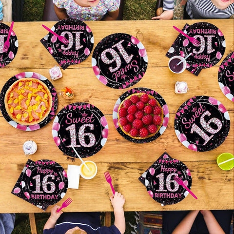 16th birthday table styled with the black and pink tableware