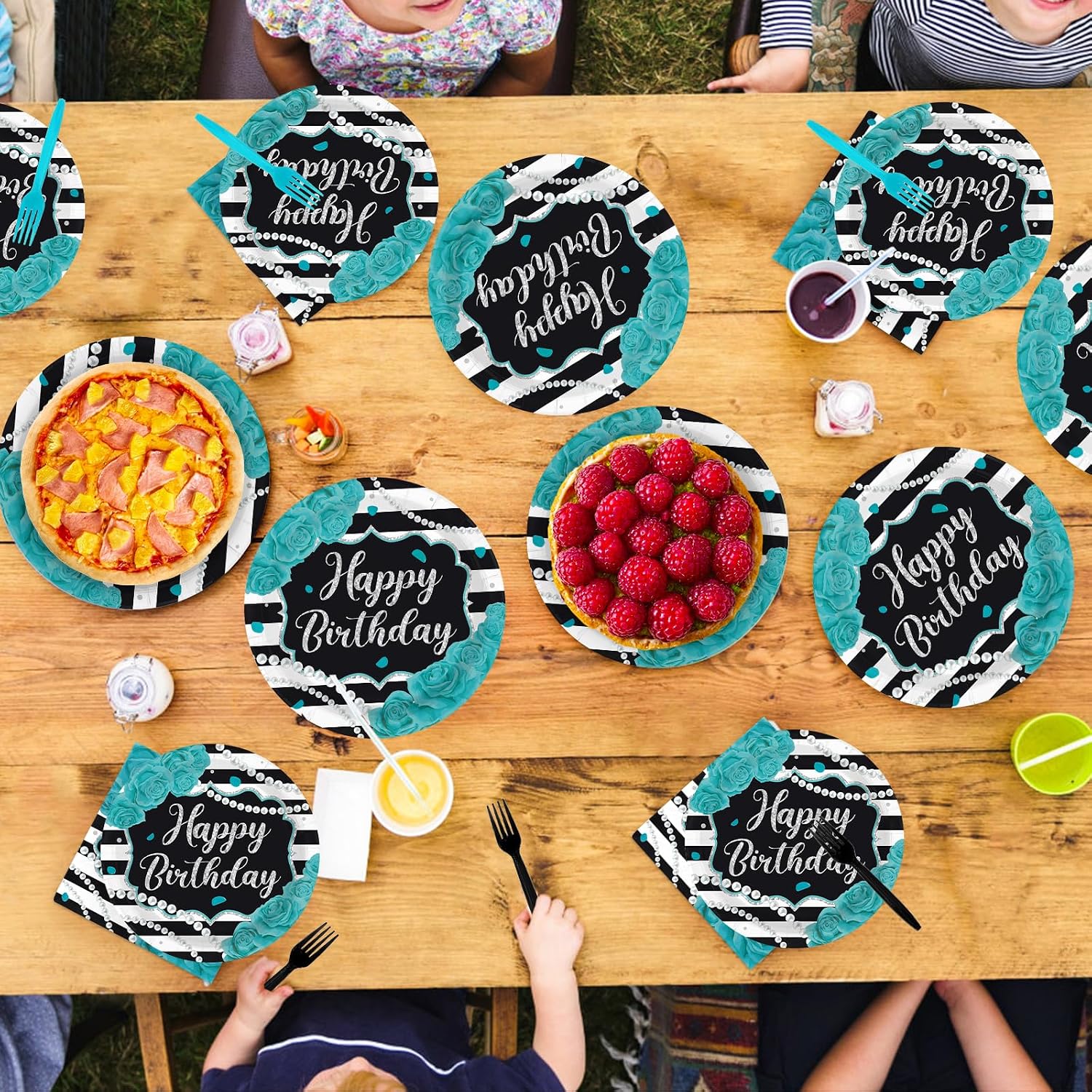 Teal black white striped birthday plates stacked for a party table