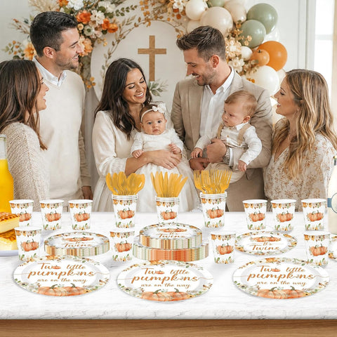 Stack of pumpkin twins baby shower paper plates