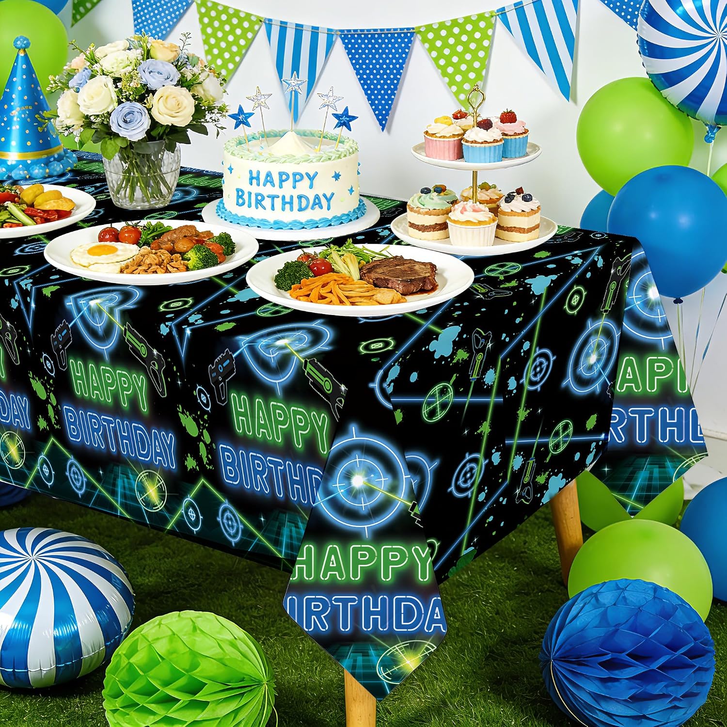 Boys shooting game birthday party scene with laser tag themed tablecloth